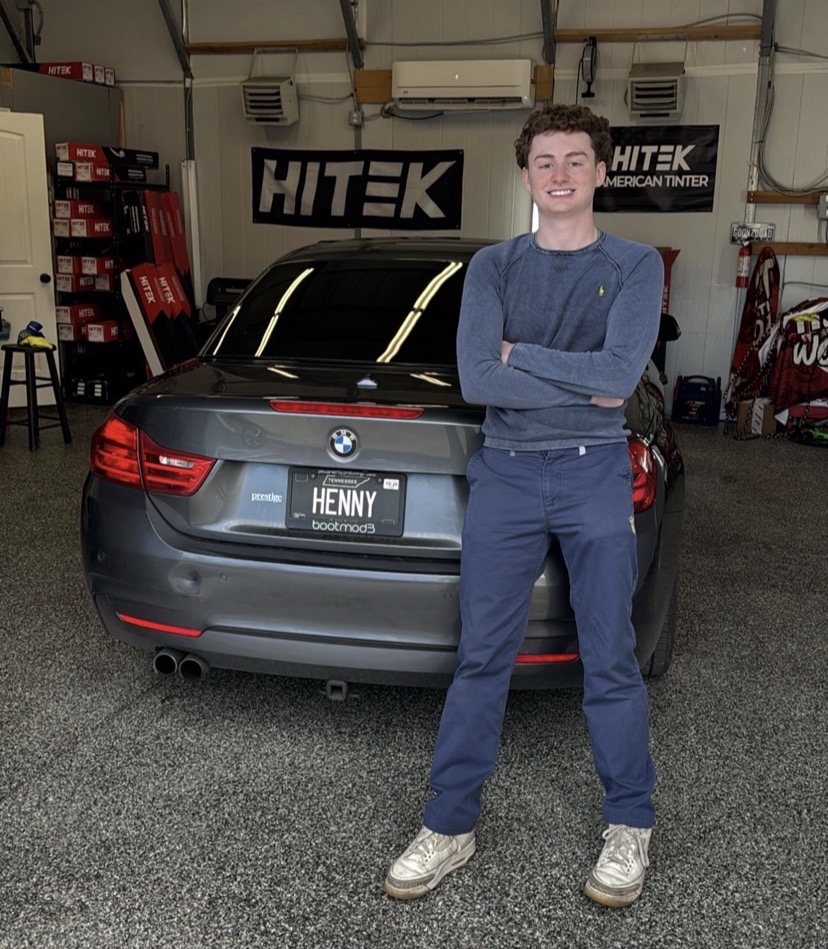 BMW owner standing with his car